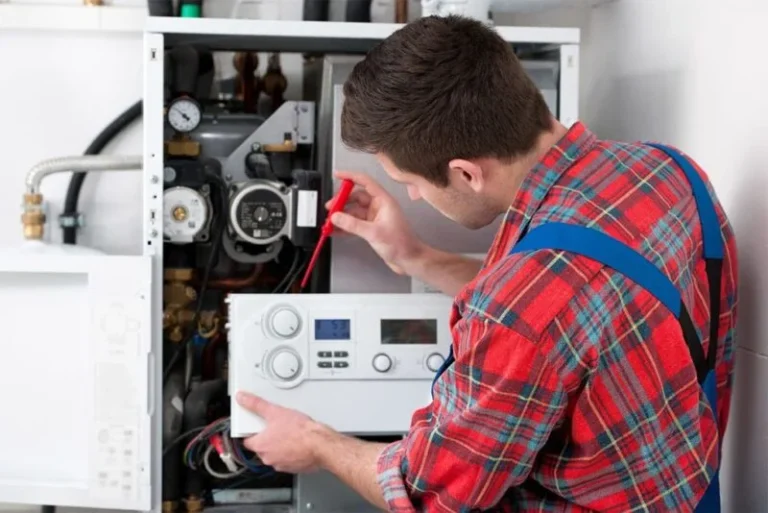 miami plumber repairing a water heater in florida home