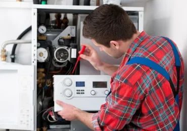 miami plumber repairing a water heater in florida home
